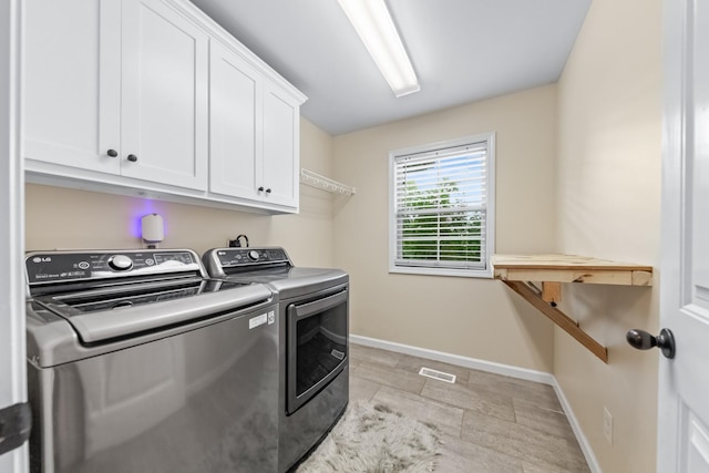 2034 Glencoe Rd, Culleoka, TN 38451 - laundry room featuring separate washer and dryer and cabinet space