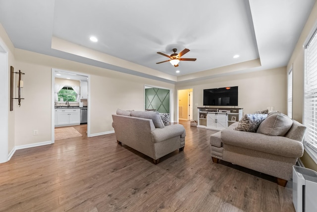 2034 Glencoe Rd, Culleoka, TN 38451 - living room with a tray ceiling, wood finished floors, ceiling fan, and recessed lighting