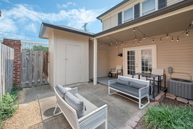 5025 Hillsboro Pike Unit 1A, Nashville, TN 37215 - view of patio featuring french doors, cooling unit, an outdoor hangout area, and a gate