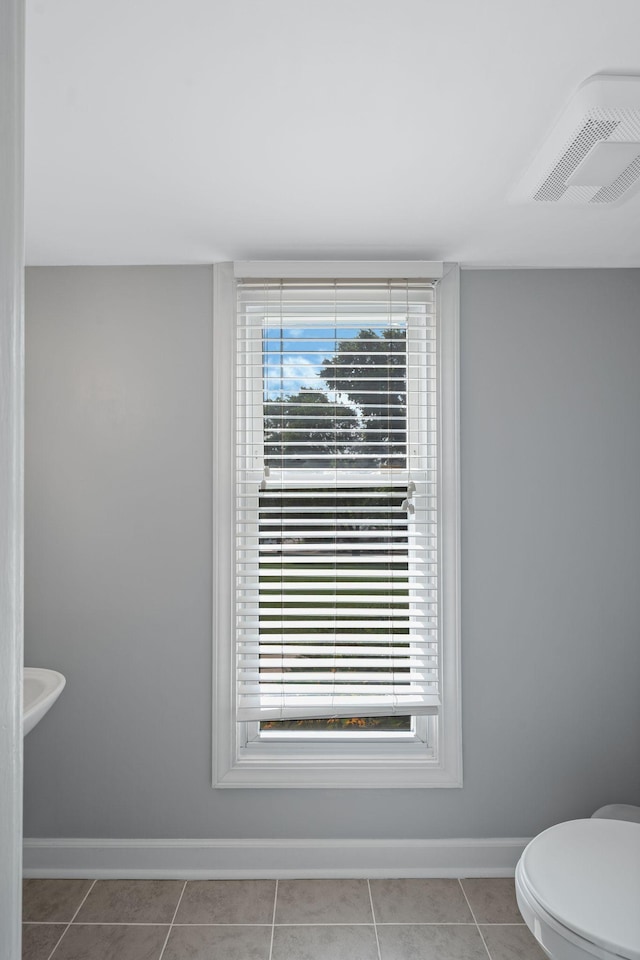 5025 Hillsboro Pike Unit 1A, Nashville, TN 37215 - bathroom with baseboards, tile patterned floors, and toilet