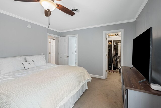 5025 Hillsboro Pike Unit 1A, Nashville, TN 37215 - bedroom featuring light carpet, crown molding, a walk in closet, baseboards, and ceiling fan
