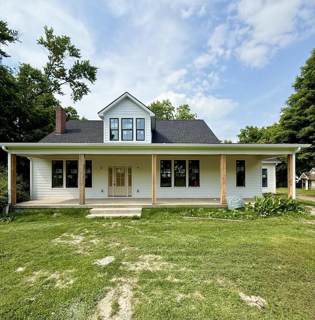 1629 Cairo Rd, Gallatin, TN 37066 - view of front facade with a chimney, a front yard, and roof with shingles