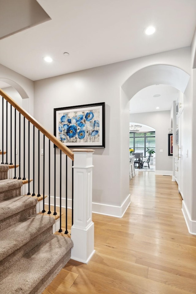 7433 Magnolia Valley Dr, Eagleville, TN 37060 - stairs with arched walkways, wood finished floors, recessed lighting, and baseboards