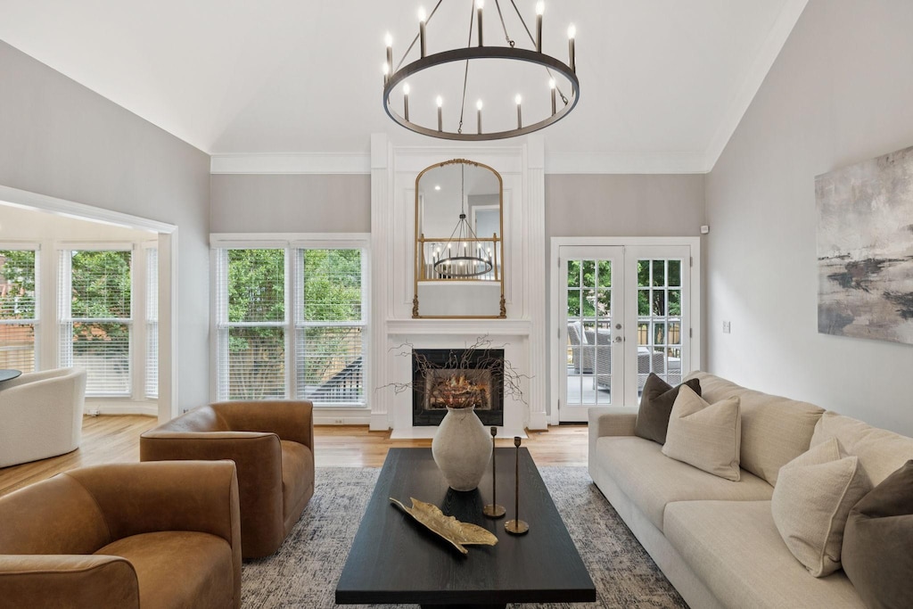 511 Forrest Park Cir, Franklin, TN 37064 - living area featuring a chandelier, healthy amount of natural light, wood finished floors, and high vaulted ceiling