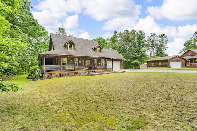 81 Pine Tree Cir, Crossville, TN 38571 - view of front facade featuring an attached garage, driveway, covered porch, and a front yard