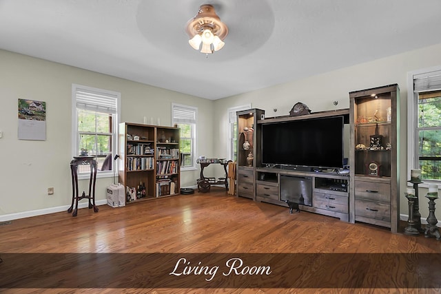81 Pine Tree Cir, Crossville, TN 38571 - living area with a ceiling fan, wood finished floors, plenty of natural light, and baseboards