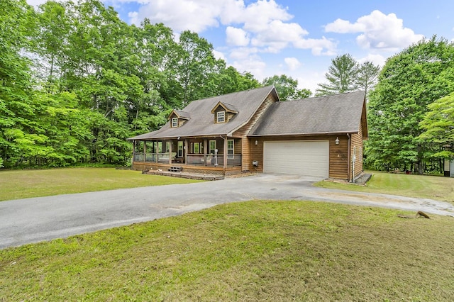 81 Pine Tree Cir, Crossville, TN 38571 - view of front of house with a porch, asphalt driveway, a garage, and a front yard