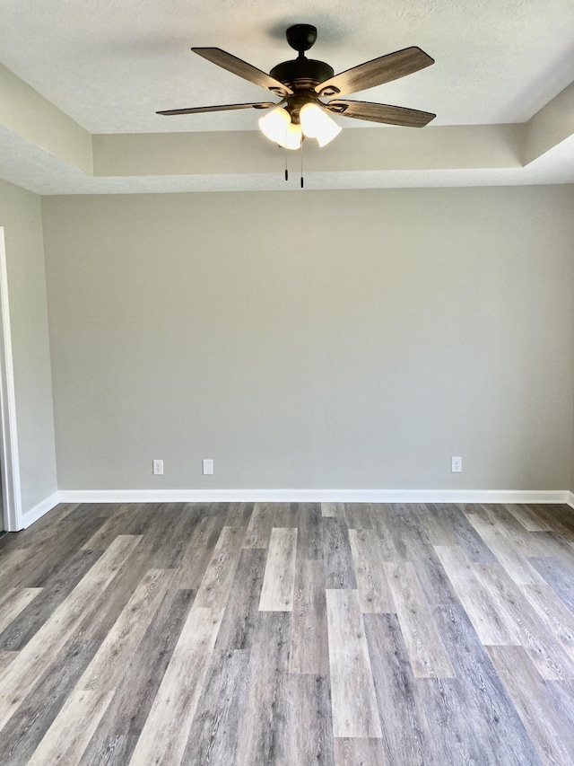 143 Mason St, Portland, TN 37148 - spare room featuring ceiling fan, wood finished floors, a textured ceiling, and baseboards