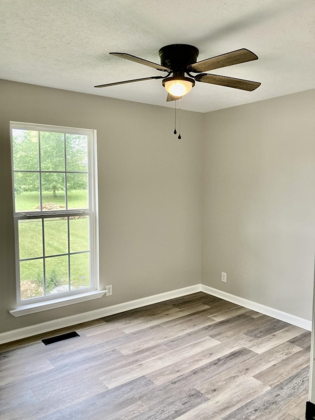 143 Mason St, Portland, TN 37148 - spare room with plenty of natural light, wood finished floors, a ceiling fan, and baseboards
