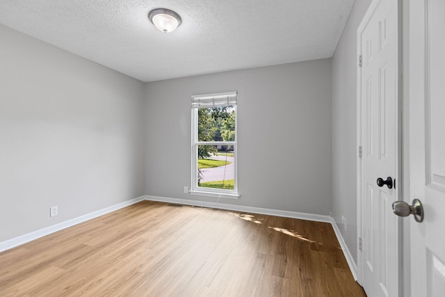 3540 Lake Towne Dr, Antioch, TN 37013 - empty room featuring wood finished floors, baseboards, and a textured ceiling