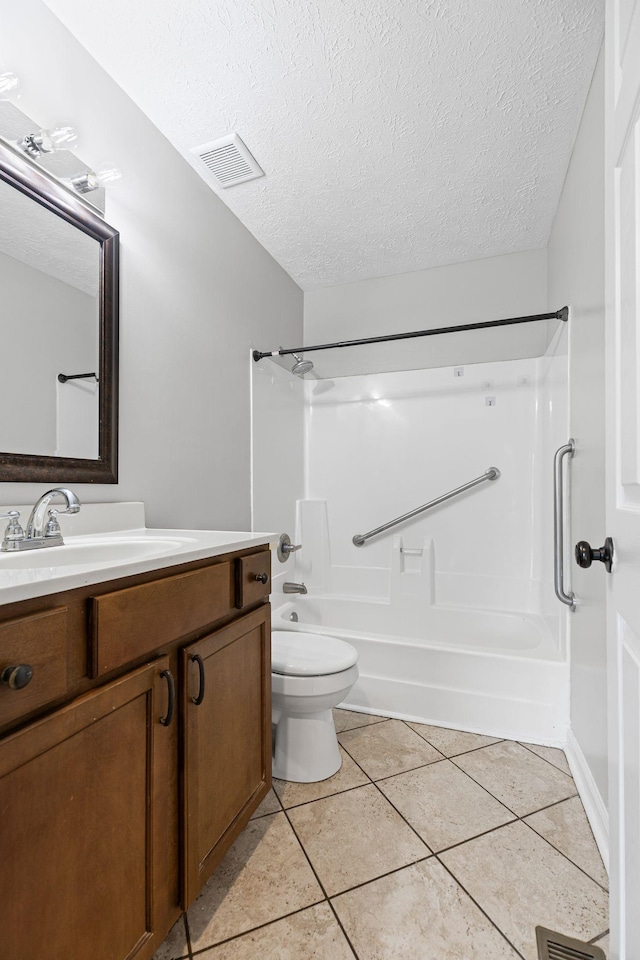 3540 Lake Towne Dr, Antioch, TN 37013 - full bathroom with vanity, tub / shower combination, a textured ceiling, tile patterned floors, and toilet