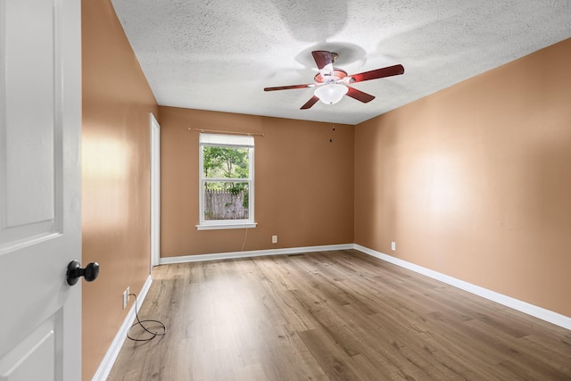 3540 Lake Towne Dr, Antioch, TN 37013 - unfurnished room with wood finished floors, a ceiling fan, a textured ceiling, and baseboards