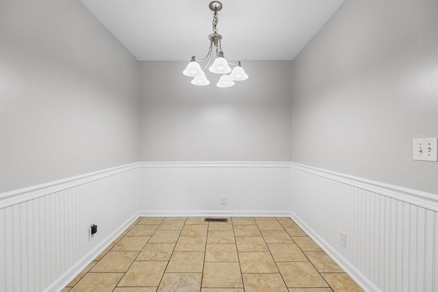 3540 Lake Towne Dr, Antioch, TN 37013 - spare room with a wainscoted wall, a chandelier, and light tile patterned floors