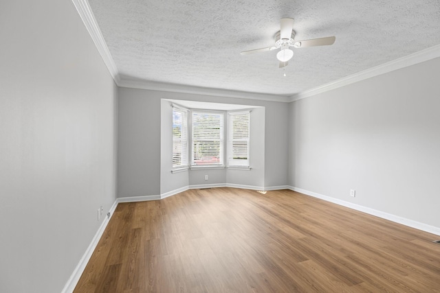 3540 Lake Towne Dr, Antioch, TN 37013 - unfurnished room featuring a ceiling fan, wood finished floors, a textured ceiling, baseboards, and ornamental molding