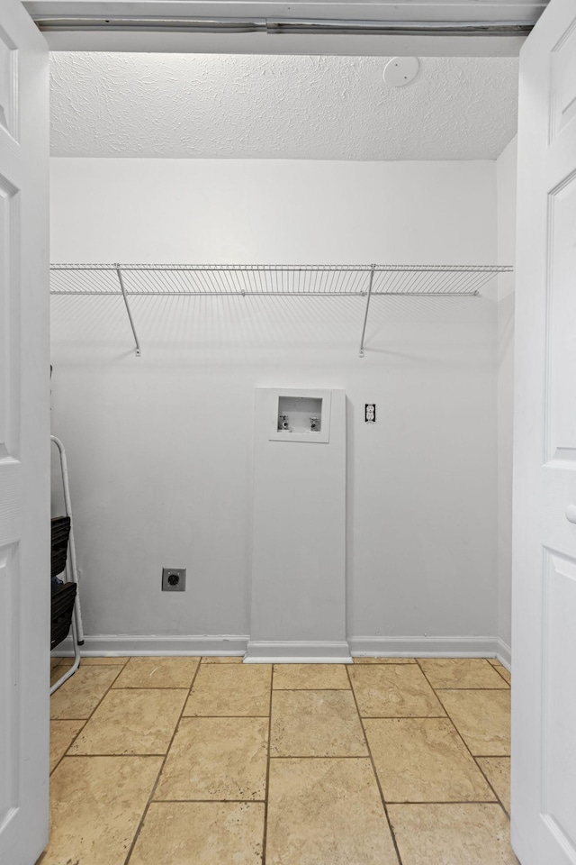 3540 Lake Towne Dr, Antioch, TN 37013 - laundry area featuring electric dryer hookup, washer hookup, a textured ceiling, and baseboards