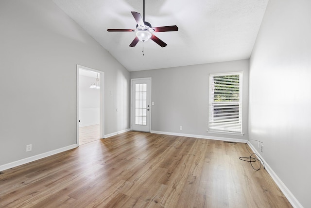 3540 Lake Towne Dr, Antioch, TN 37013 - spare room with plenty of natural light, a ceiling fan, vaulted ceiling, and light wood-type flooring