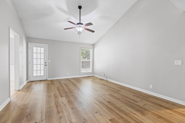 3540 Lake Towne Dr, Antioch, TN 37013 - unfurnished room with vaulted ceiling, a ceiling fan, light wood-style floors, baseboards, and a textured ceiling