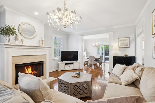 200 Addison Ave, Franklin, TN 37064 - living room featuring a chandelier, hardwood / wood-style flooring, healthy amount of natural light, ornamental molding, and a high end fireplace