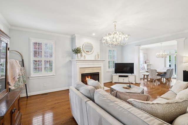 200 Addison Ave, Franklin, TN 37064 - living area with a chandelier, a premium fireplace, ornamental molding, wood finished floors, and baseboards
