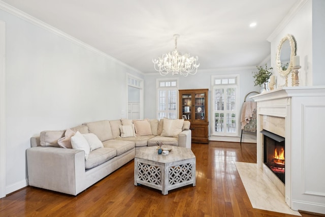 200 Addison Ave, Franklin, TN 37064 - living room with wood finished floors, a chandelier, crown molding, and a fireplace
