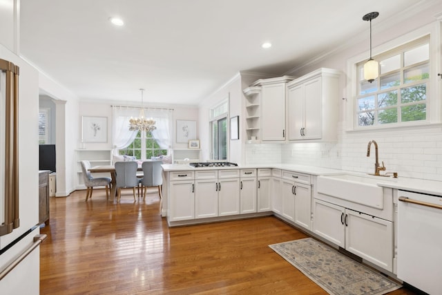 200 Addison Ave, Franklin, TN 37064 - kitchen with dishwasher, a sink, crown molding, healthy amount of natural light, and open shelves