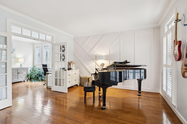 200 Addison Ave, Franklin, TN 37064 - living area featuring french doors, hardwood / wood-style flooring, ornamental molding, and a decorative wall