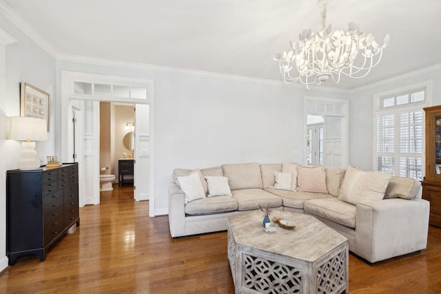 200 Addison Ave, Franklin, TN 37064 - living area with crown molding, a chandelier, wood finished floors, and baseboards