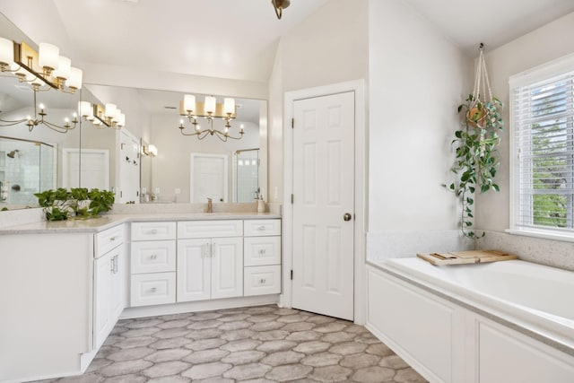 200 Addison Ave, Franklin, TN 37064 - full bathroom with a chandelier, healthy amount of natural light, vanity, lofted ceiling, and a bath