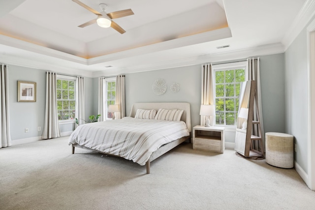 200 Addison Ave, Franklin, TN 37064 - bedroom featuring a tray ceiling, light colored carpet, multiple windows, and ornamental molding