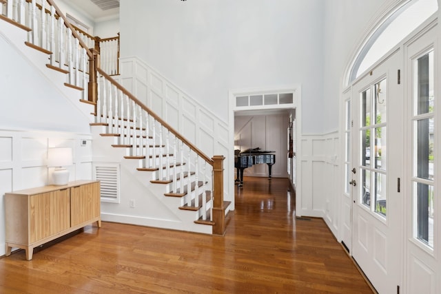 200 Addison Ave, Franklin, TN 37064 - entrance foyer with a decorative wall, a high ceiling, wood finished floors, and stairs