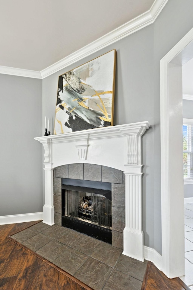 5239 Starnes Dr, Murfreesboro, TN 37128 - detailed view of ornamental molding, a tile fireplace, baseboards, and wood finished floors