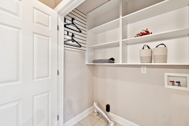 5239 Starnes Dr, Murfreesboro, TN 37128 - laundry area featuring tile patterned floors, washer hookup, and baseboards
