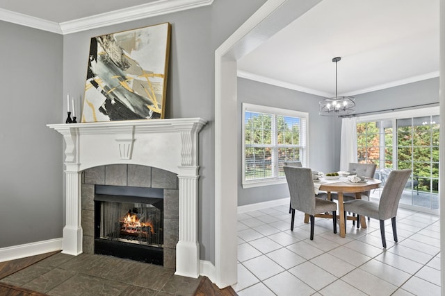 5239 Starnes Dr, Murfreesboro, TN 37128 - dining area with baseboards, a tiled fireplace, crown molding, healthy amount of natural light, and a chandelier