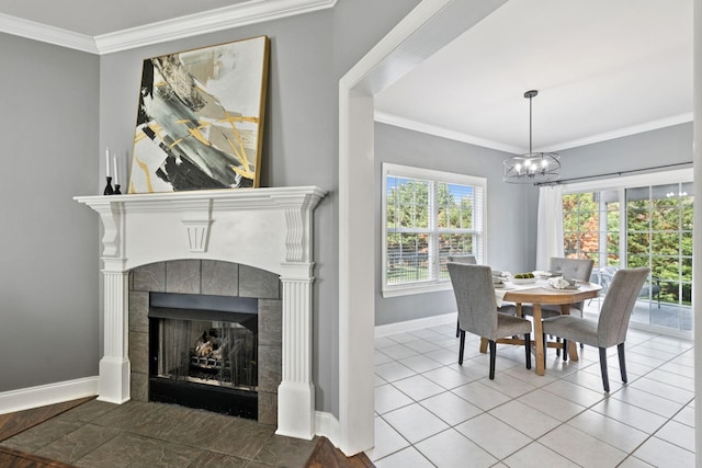 5239 Starnes Dr, Murfreesboro, TN 37128 - dining area featuring baseboards, ornamental molding, a chandelier, a tile fireplace, and tile patterned floors
