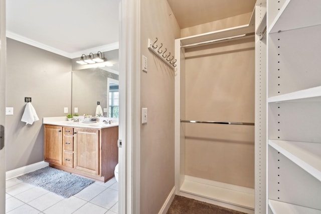 5239 Starnes Dr, Murfreesboro, TN 37128 - bathroom with double vanity, baseboards, tile patterned floors, and ornamental molding