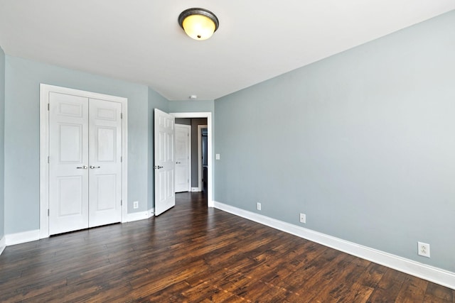 5239 Starnes Dr, Murfreesboro, TN 37128 - unfurnished bedroom featuring baseboards, a closet, and dark wood-style flooring