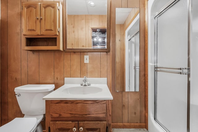 1634 Falling Water Rd, Sparta, TN 38583 - full bath featuring wooden walls, toilet, vanity, and a shower stall