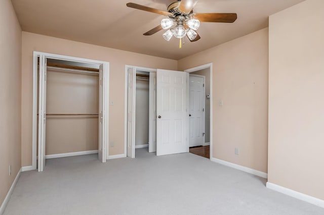 1634 Falling Water Rd, Sparta, TN 38583 - unfurnished bedroom with multiple closets, carpet floors, baseboards, and ceiling fan