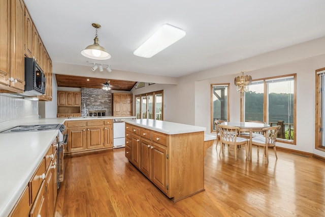 1634 Falling Water Rd, Sparta, TN 38583 - kitchen featuring a large fireplace, light wood-type flooring, light countertops, white dishwasher, and beamed ceiling