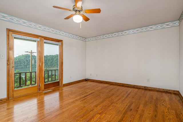1634 Falling Water Rd, Sparta, TN 38583 - empty room featuring light wood finished floors, baseboards, and a ceiling fan