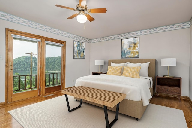 1634 Falling Water Rd, Sparta, TN 38583 - bedroom featuring wood finished floors, access to outside, multiple windows, and ceiling fan