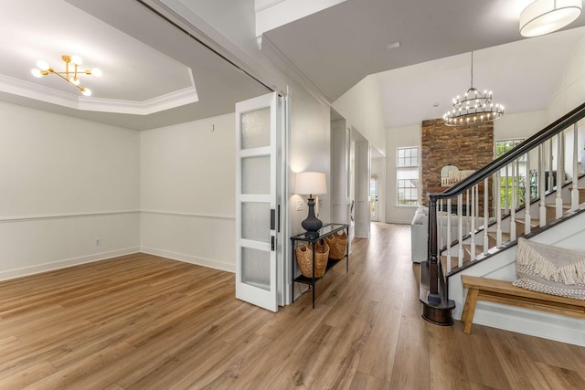 115 Wise Rd, Franklin, TN 37064 - foyer with a chandelier, wood finished floors, stairway, ornamental molding, and baseboards