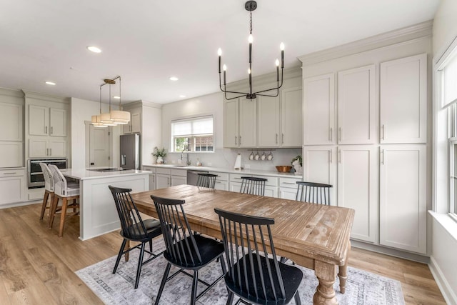 115 Wise Rd, Franklin, TN 37064 - dining area with a chandelier, light wood-style floors, recessed lighting, and ornamental molding