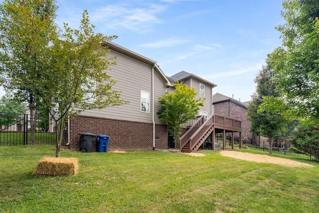 115 Wise Rd, Franklin, TN 37064 - rear view of house with brick siding, stairs, and a wooden deck