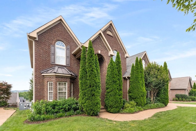 115 Wise Rd, Franklin, TN 37064 - view of front of property with brick siding and a front lawn