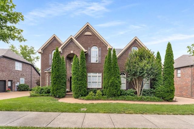 115 Wise Rd, Franklin, TN 37064 - traditional-style house with brick siding and a front lawn
