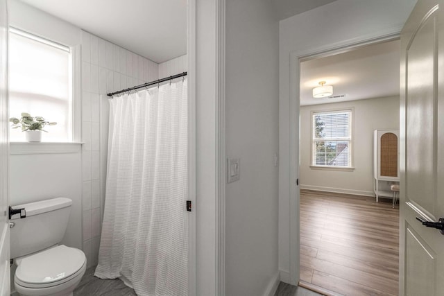 115 Wise Rd, Franklin, TN 37064 - full bath with toilet, curtained shower, wood finished floors, and baseboards