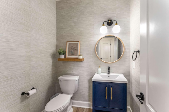 115 Wise Rd, Franklin, TN 37064 - bathroom featuring toilet, vanity, wood finished floors, and baseboards