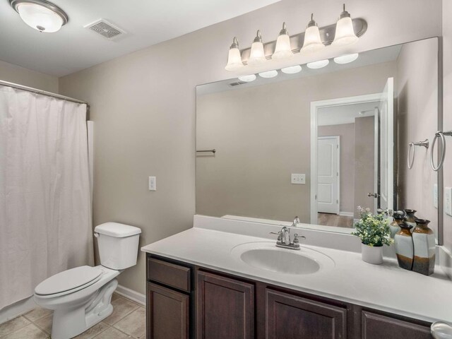 3031 Joseph Dr, Spring Hill, TN 37174 - full bathroom with toilet, vanity, tile patterned floors, and a shower with shower curtain