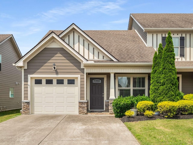 3031 Joseph Dr, Spring Hill, TN 37174 - view of front of home with driveway, roof with shingles, a garage, and board and batten siding